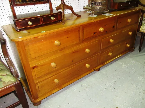 A 20th century pine sideboard with three short and four long drawers, 172cm wide x 72cm high. F9