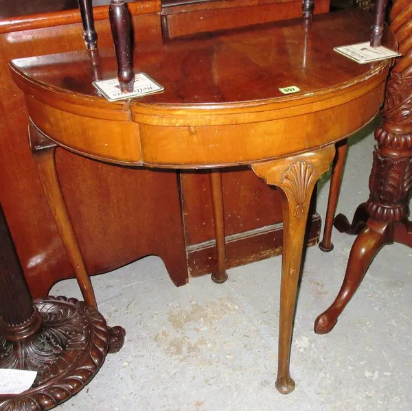 A George II style walnut card table, on tapering pad feet, 80cm wide x 72cm high. F6