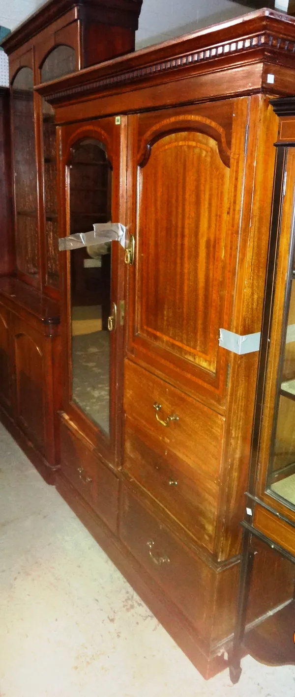 An Edwardian mahogany inlaid double wardrobe, with mirrored door and arrangement of drawers and cupboard, 120cm wide x 165cm high.  M8