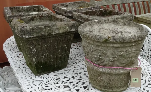 A set of four early 20th century stone square planters, of tapering form with fluted decoration, 35cm wide x 35cm high, and another 20th century stone