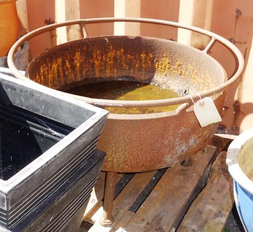 A 20th century wrought iron fire pit, 69cm wide x 47cm high.  OUT