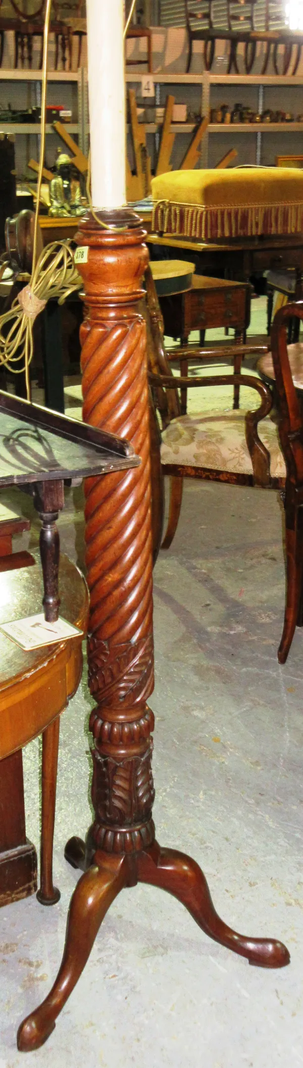 A Victorian mahogany spiral twist standard lamp, on three downswept cabriole supports, 175cm high, together with another on a reeded column and ball a