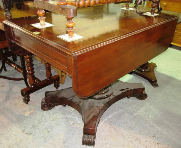 A Victorian mahogany drop flap centre table, on acanthus carved column and quatrefoil base, 101cm wide x 75cm high.   F8