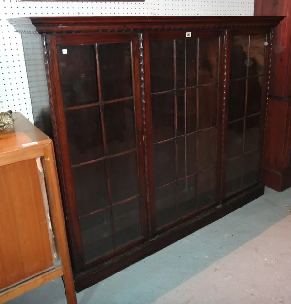 A mid-20th century oak floor standing bookcase, 145cm wide x 129cm high. J9