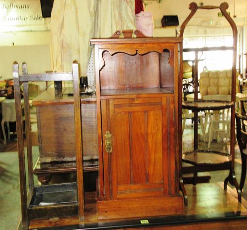 A 19th century mahogany pot cupboard, 38cm wide x 76cm high, an early 20th century walnut three tier cake stand, 29cm wide x 92cm high, and a 20th cen