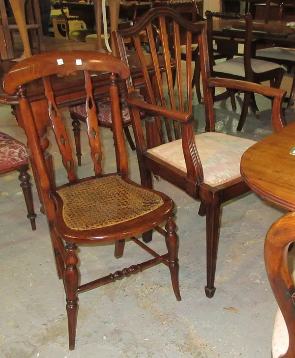 A pair of 19th century teak open armchairs on fluted tapering supports, and a Victorian mahogany side chair, (3).  F7