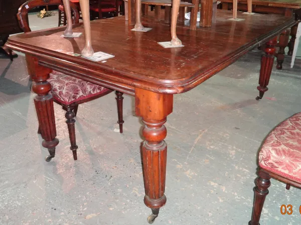 An early Victorian mahogany extending dining table on tapering reeded supports, with two extra leaves, 104cm wide x 122cm long, 177cm long extended.