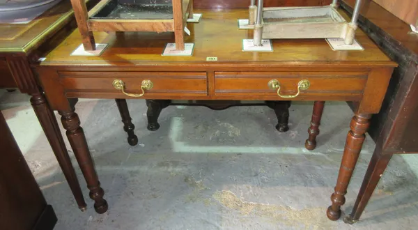 A late Victorian mahogany two drawer writing table, on turned supports, 105cm wide.  C8