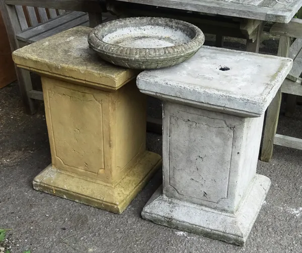 A pair of 20th century reconstituted stone square plinths, 42cm wide x 58cm high, and a 20th century reconstituted circular bird bath, 40cm wide x 8cm