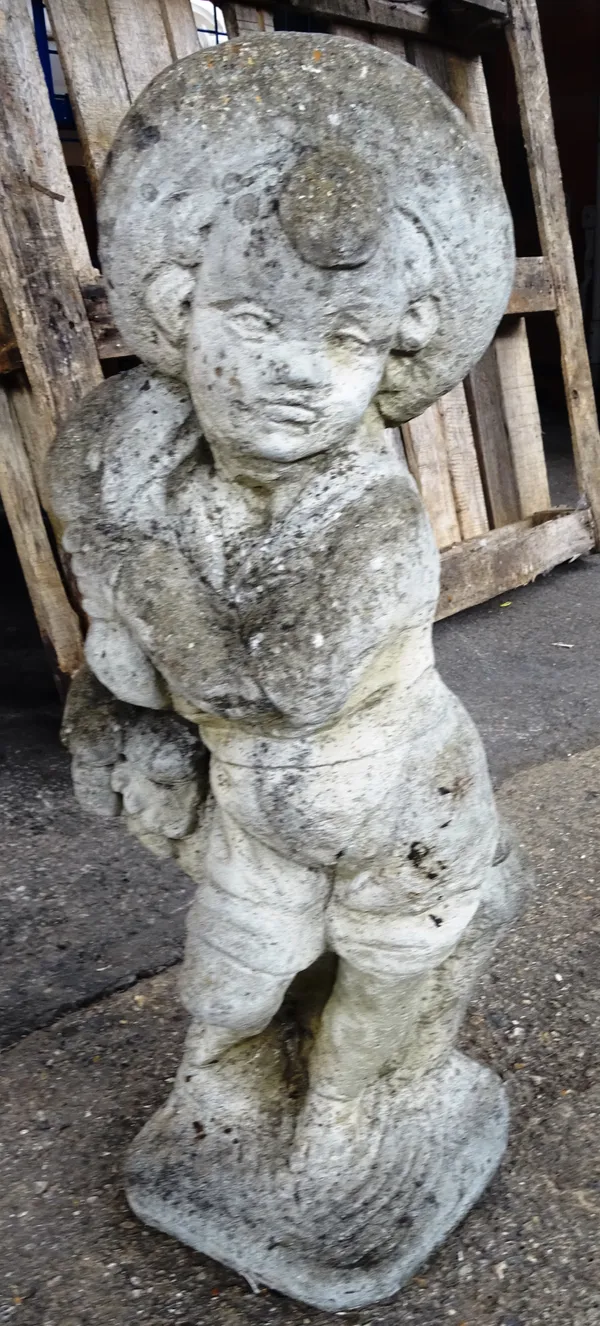 A 20th century reconstituted stone figure of a boy, 72cm high.  OUT