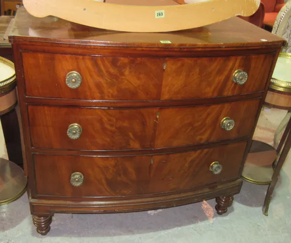 A late George III mahogany bowfront chest of three long drawers, on ring turned tapering supports, 96cm wide x 88cm high.  D5