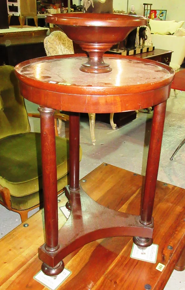 A Regency style mahogany jardiniere stand with dished bowl top, on trefoil base united by three turned supports, 44cm wide x 86cm high.  C6