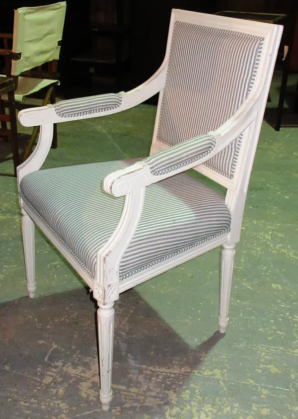 A pair of Louis XVI style white painted open armchairs, (2).  I7