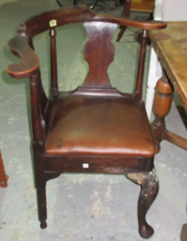 An early George III beech and mixed wood corner chair, on tapering pad feet. I7