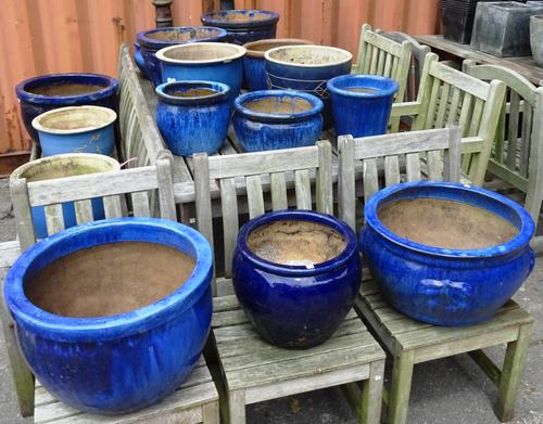 Garden statuary, comprising; a group of seventeen 20th century blue glazed terracotta planters of various sizes, (17). OUT