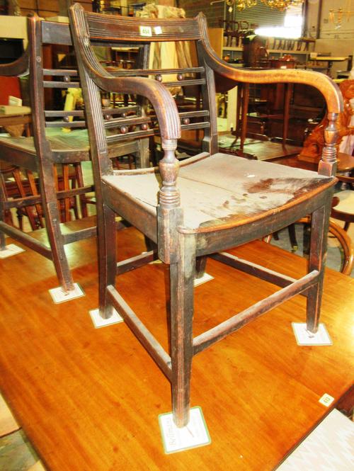 A pair of East Anglian early 19th century ash and elm button back carver chairs, (a.f), (2).   F7