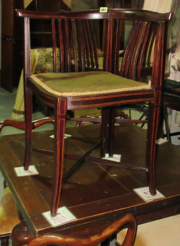 A pair of Edwardian mahogany corner chairs, on tapering supports, (2). I6