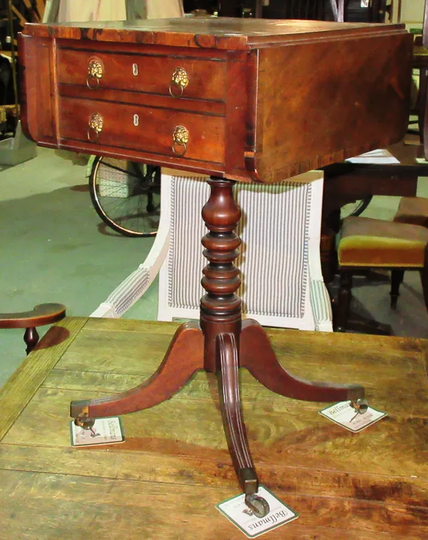 A Regency mahogany drop flap work table, on ring turned column on splayed scroll supports, 45cm wide x 71cm high. I7