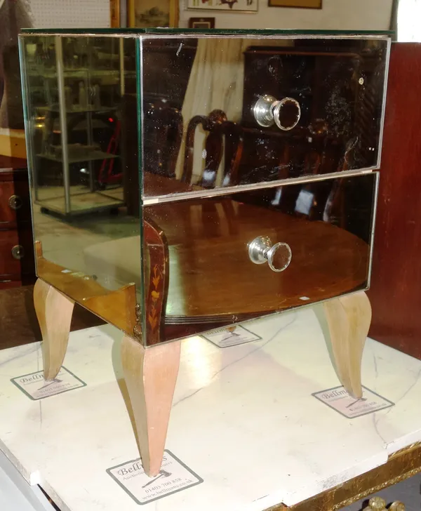 A pair of early 20th century mirrored bedside chests of two short drawers, on tapering supports, 39cm wide x 54cm high, (2), (a.f).  E5