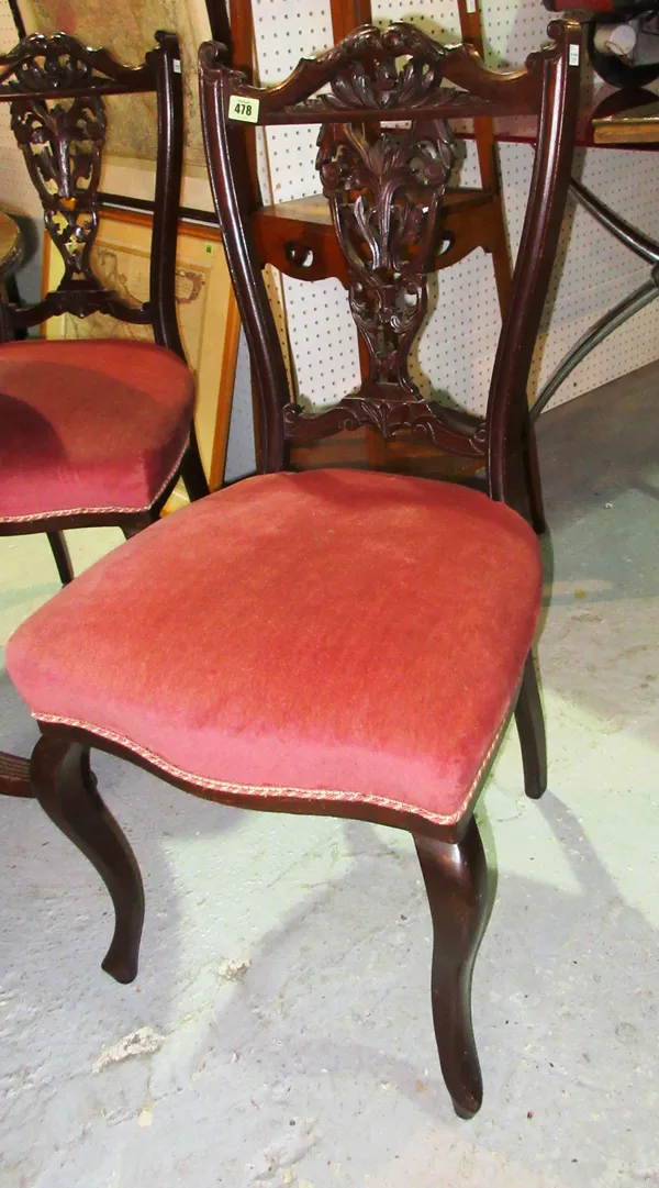 A set of four Edwardian mahogany dining chairs, on cabriole supports, (4).  A4
