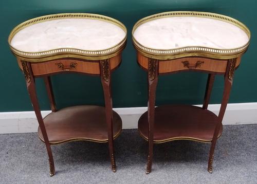 A pair of Louis XV style occasional tables, each with galleried kidney shape marble top, over a gilt metal mounted stained beech single drawer base, u