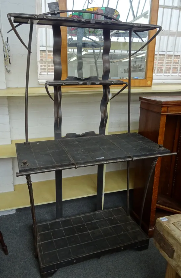 A. Longley & R. McCutcheon (1999); a 20th century wrought iron and slate four tier hall console table and stand, 113cm wide x 192cm high x 50cm deep.