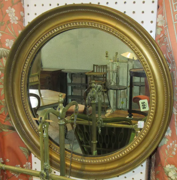 A late 19th century circular mirror in gilt frame, 51cm diameter.  D6