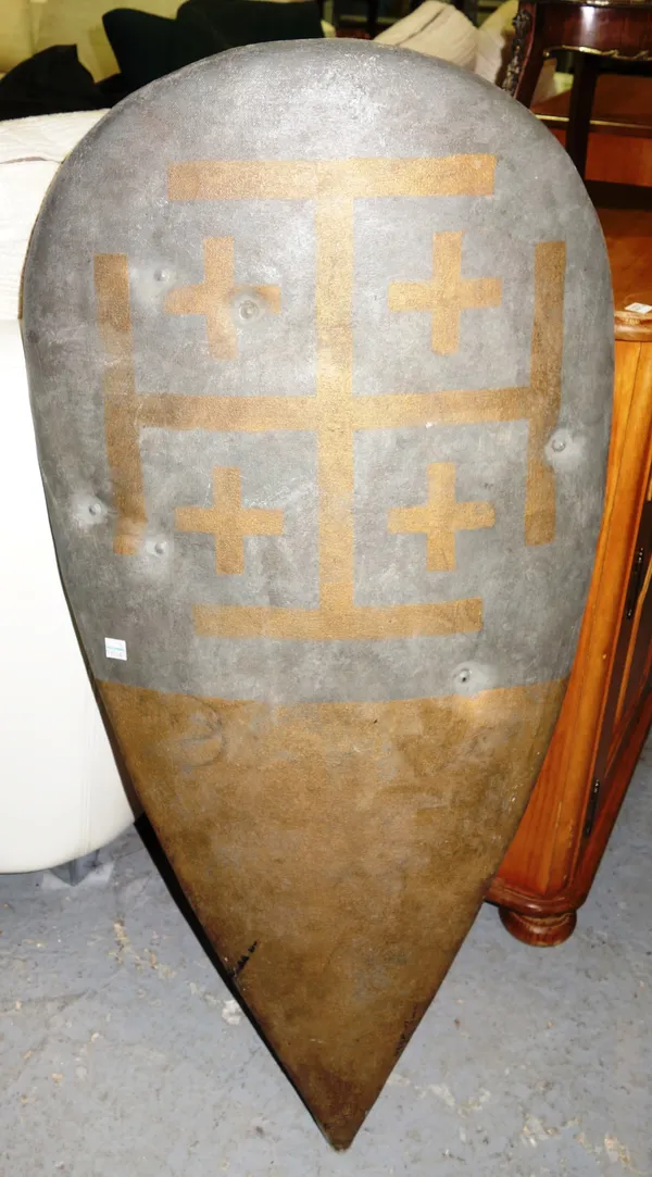 Film props, comprising; a shaped wood and canvas shield with painted decoration, allegedly from the film Kingdom of Heaven, 2005, 20th century Fox, 94