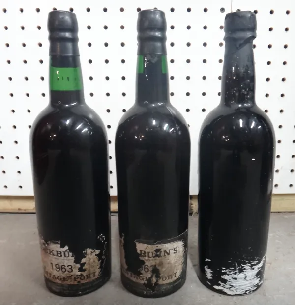 Two bottles of 1963 Cockburns vintage port and one bottle of 1960 Quinta da Noval port (lacking label), (3).