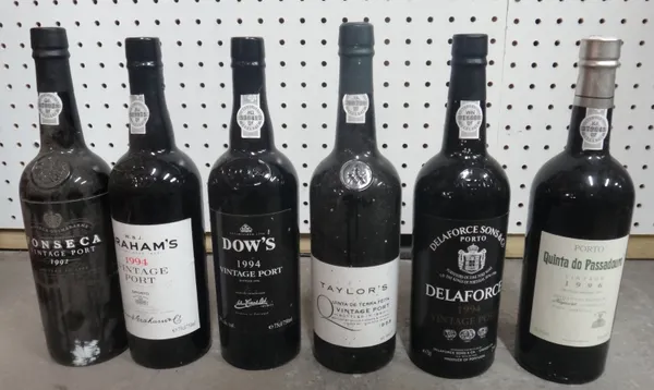 Nine bottles of port comprising; Four 1988 Taylors vintage, 1992 Fonseca vintage, 1994 Dows vintage, 1994 Delaforce vintage, 1994 Grahams vintage and