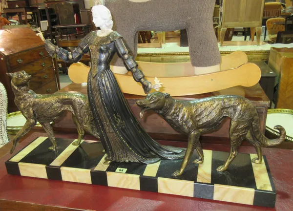 An Art Deco gilt metal and marble figure group depicting a lady flanked by hounds (a.f.) 85cm. C5