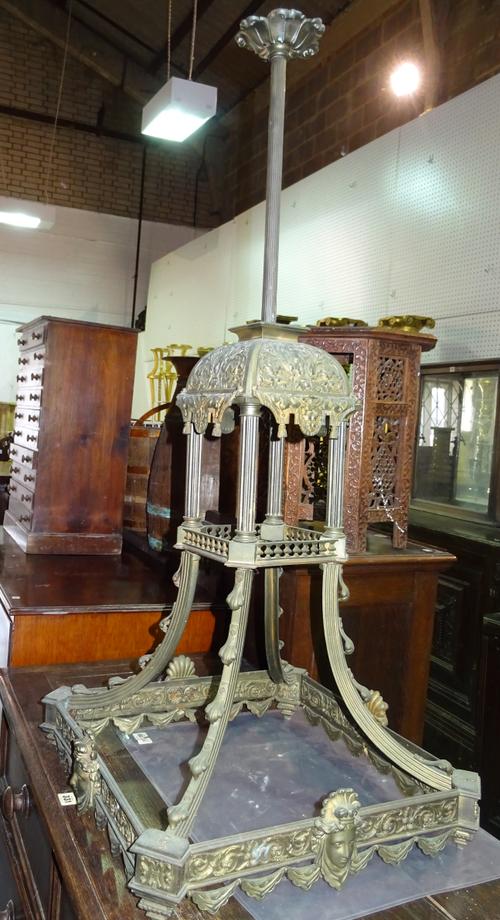 An early 20th century bronze ceiling light decorated with moulded panels of flora and putti. G8