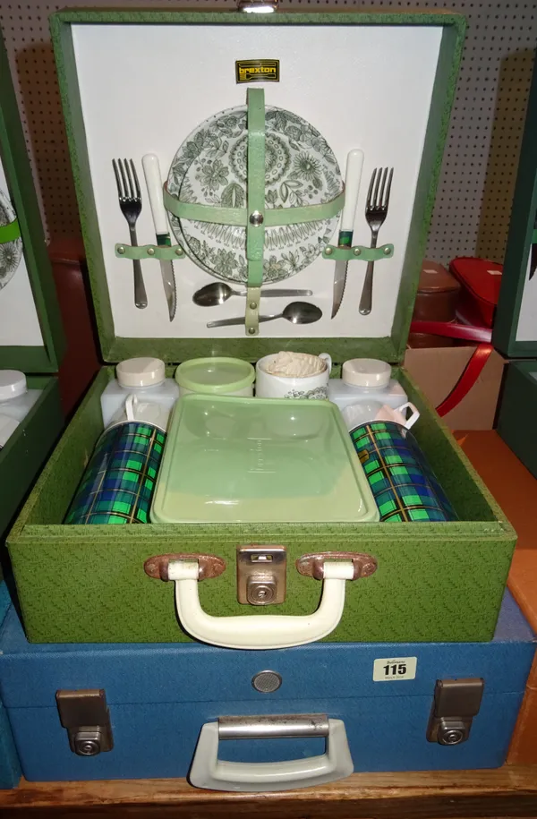 A blue cased Brexton picnic set for four, and another in green for two, (2).  K1