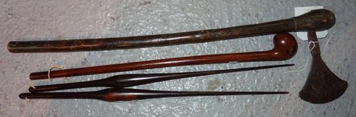 An African steel axe head with engraved decoration on a later shaft, two 19th century lignium vitea fids (53cm), and a small African wooden club of na