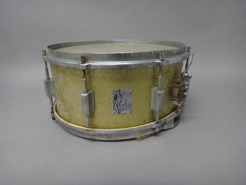 A vintage drum kit and accessories, comprising, Carlton goldflake snare drum, two Carlton Toms Toms,  Queen painted base drum, metal Tom Tom and an as