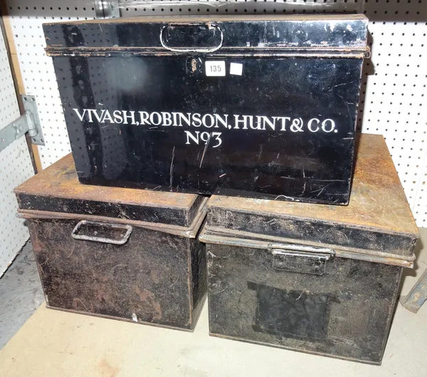 A group of three early 20th century black painted metal storage boxes, together with an early 20th century brown leather travelling suitcase, (4).  S4