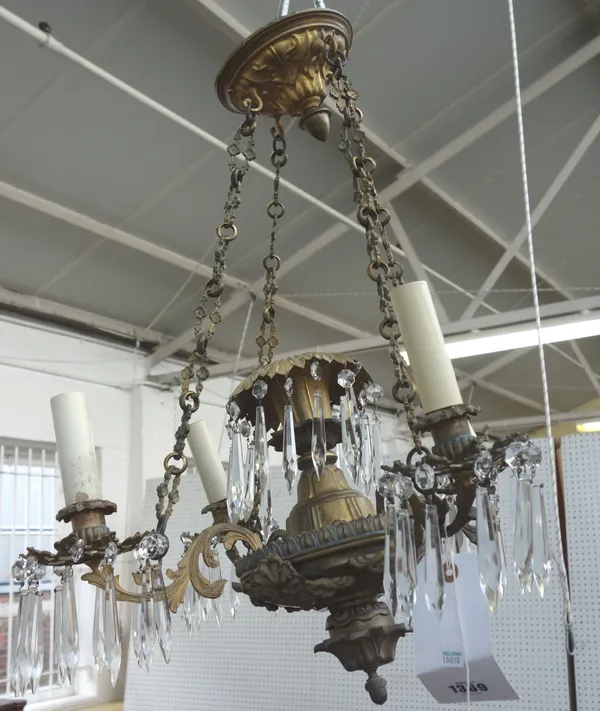 A Victorian style gilt metal four branch chandelier, the foliate pierced drip pans hung with crystal drops, 51cm diameter.
