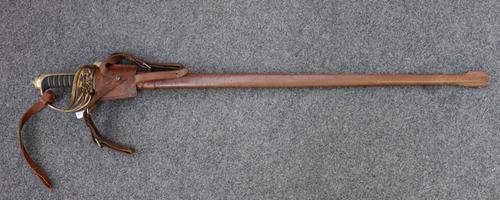 An English officer's sword, with single edged engraved steel blade (82cm long) detailed 'F.C Scott, London', with a brass hilt, wire bound fish skin g