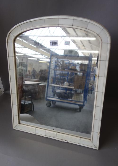 A early 20th century Continental ivory mounted strut back table mirror (50cm high), and a foliate carved wooden pot and cover of spherical form, on a