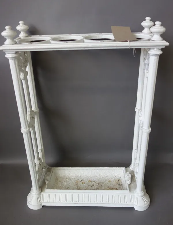 A Victorian cast iron stick stand, white painted, with four circular divisions and a removable drip tray,63cm high, an Irish Shillelagh, and a shorten