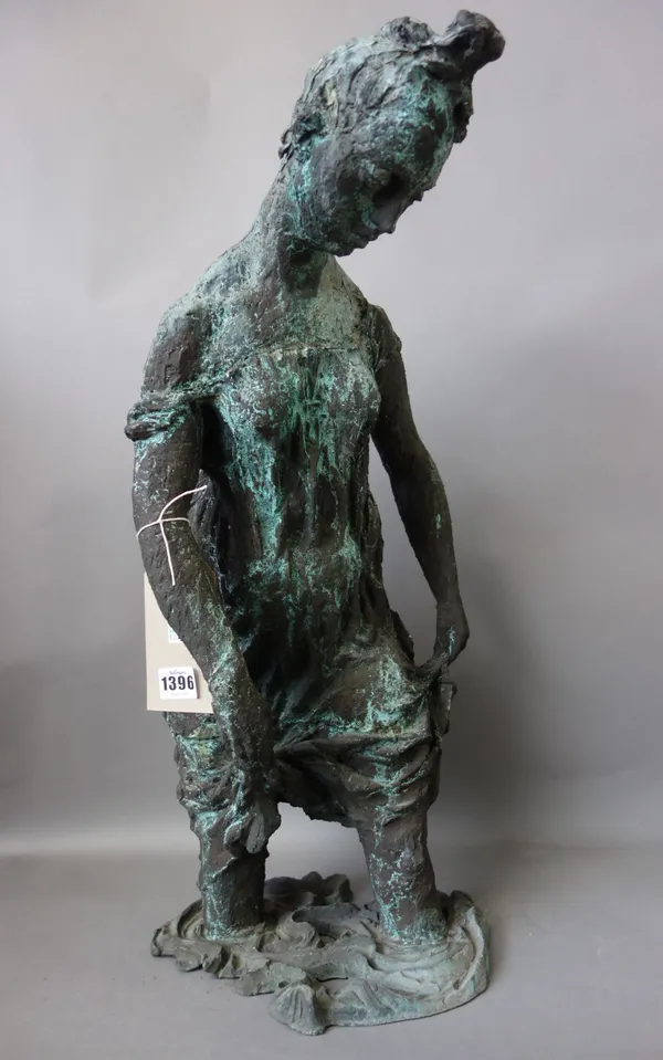 A modern patinated metal figure depicting a woman knee high in a naturalistic 'water' base, un-signed, 62cm high.