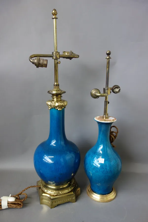 A Chinese ormolu mounted blue ground table lamp of bottleneck form, vase 30cm and another smaller similar table lamp, both with cream pleated shades,