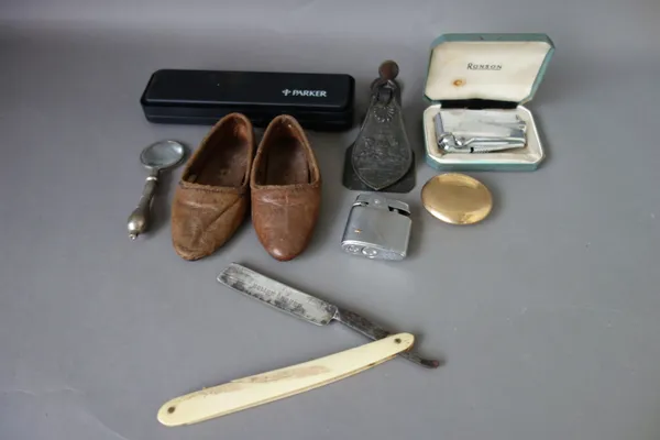 A quantity of small collectables, including; a silver topped glass toilet jar, medals, thimbles, brass weights, lighters and sundry, (qty).