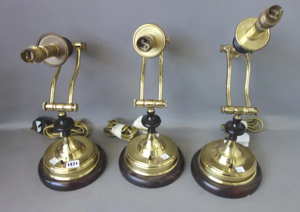 A set of three Victorian style brass and mahogany adjustable desk lamps, (3).