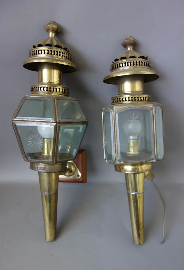 A pair of gilt metal and etched glass coaching lamps, with applied plaques for 'London Lamp Co', 53cm high, another similar pair, and one further, (5)