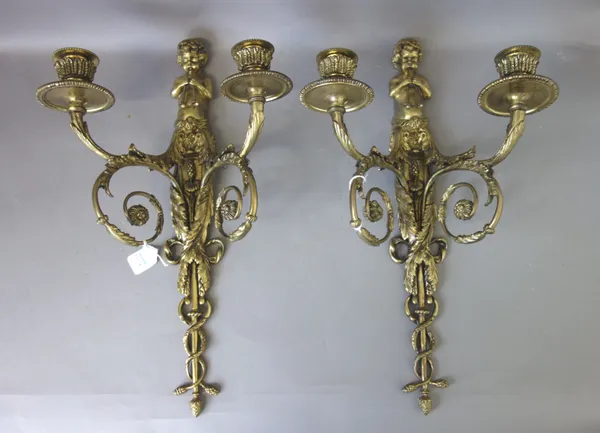 A pair of Louis XVI style gilt bronze twin branch figural wall appliques, late 19th century, with a putto surmount over a foliate backplate issuing tw