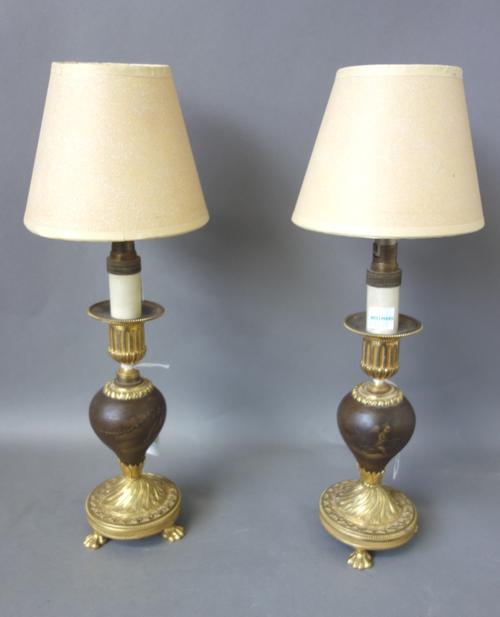 A pair of French gilt bronze and Vernis Martin dwarf candlestick, late 18th century, foliate cast on three lion paw feet, 185cm high, later adapted to