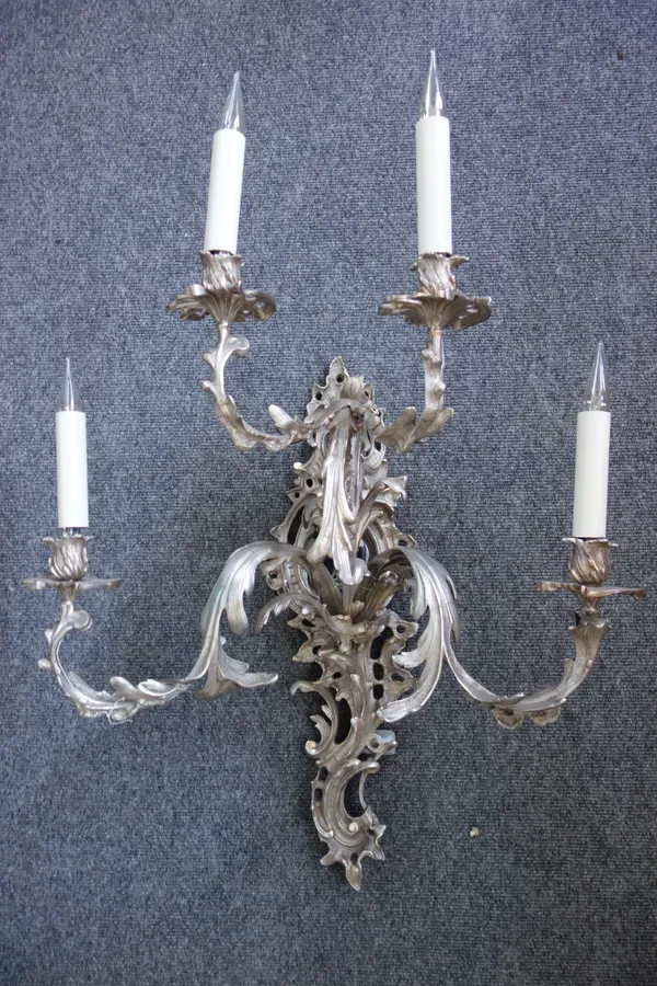 A Rococo revival silver painted four branch girandole wall light, 65cm high, excluding fittings. 56cm high.