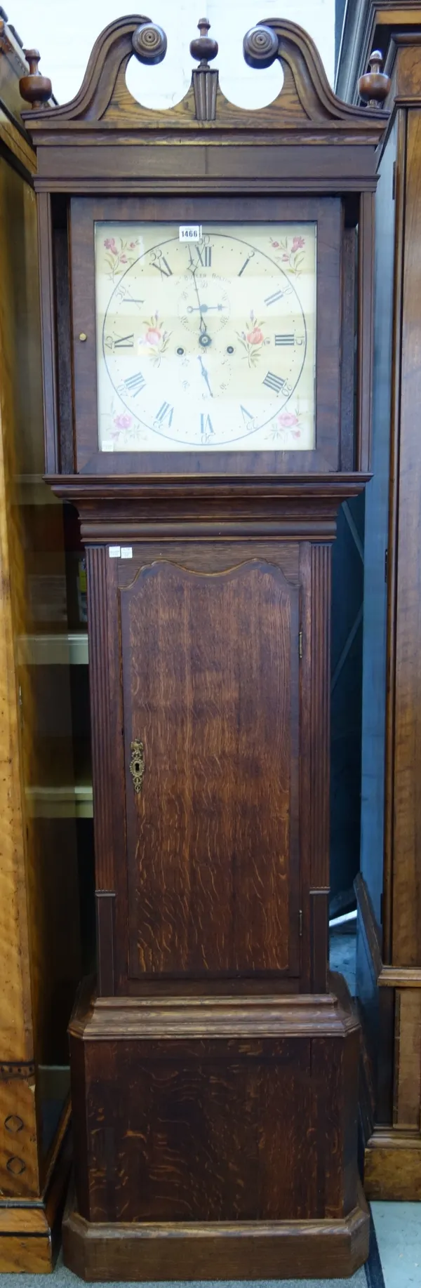 An oak and mahogany longcase clock, 19th century, by 'J.A.S BUTLER, BOLTON', with broken arch pediment and foliate painted dial, with two subsidiary d
