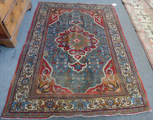 A Bidjar rug, early 20th century, with central medallion and pale blue field and ivory ground foliate main border, 140cm x 182cm